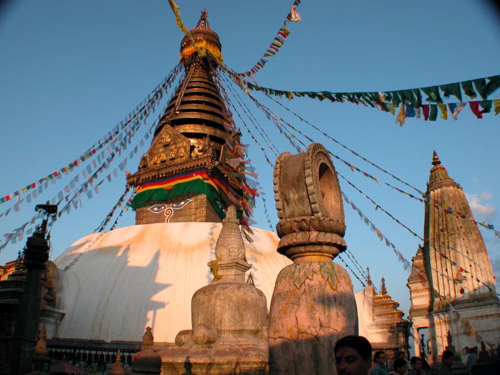 Manaslu 00 10 Kathmandu Swayambhunath From Boudhanath I took a taxi to the monkey temple, Swayambhunath, which shone beautifully in the late afternoon sun. The earliest record of this stupa's existence dates from a 5C stone inscription; however, scholars and archaeologists believe that there was probably a shrine here as far back as 2,000 years ago.